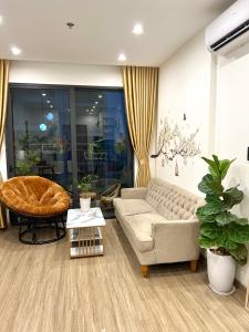 a living room with a couch and a table at Smart homestay in Hanoi