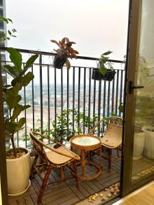 a balcony with chairs and a view of the ocean at Smart homestay in Hanoi