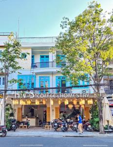 a building with motorcycles parked in front of it at An's Family Homestay Hoi An - 5mins walk to Hoi An Ancient Town in Hoi An