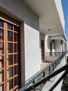 a balcony of a building with a door and a window at Appartamento Ida vacanza mare in Policoro