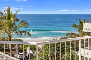 a view of the beach from the balcony of a resort at 9 La Mer, 5 Belmore Tce - Ultimate Beachside Living in Sunshine Beach