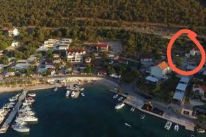 an aerial view of a harbor with boats in the water at Studio apartman Barbeta in Grebaštica