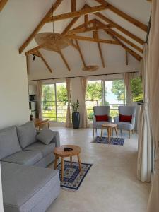 a living room with a couch and a table at Sonrisa Villas in Diani Beach