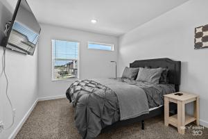 a bedroom with a bed and a window at Pacific Palace-NEW 2bed 2 5bath Home in Centerton in Bentonville
