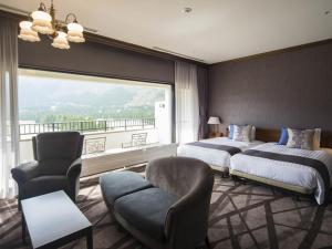 Postel nebo postele na pokoji v ubytování Hakone Sengokuhara Prince Hotel