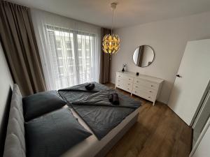 מיטה או מיטות בחדר ב-Apartmán Rezidencia POVRAZY I