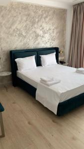 Postel nebo postele na pokoji v ubytování Chimaera Hotel