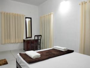 Guestland Homestay客房内的一张或多张床位