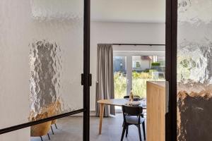 a room with a table and a wall covered in mold at Luxe strandappartement met zonneterras & parking in Koksijde