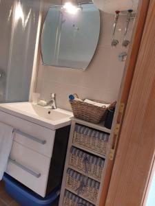 a bathroom with a sink and a mirror at Apartmani Neda in Čitluk +77 photos