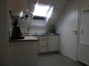 Kuchyň nebo kuchyňský kout v ubytování Nr 28 - Ferienwohnung Am Yachthafen
