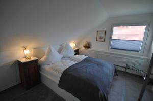 Postel nebo postele na pokoji v ubytování Nr 28 - Ferienwohnung Am Yachthafen