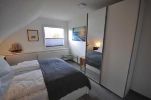 Postel nebo postele na pokoji v ubytování Nr 28 - Ferienwohnung Am Yachthafen