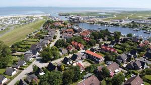 an aerial view of a small town next to a river at Nr 28 - Ferienwohnung Am Yachthafen in Harlesiel