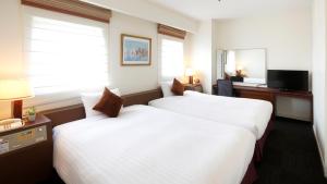 Voodi või voodid majutusasutuse Hotel Resol Sasebo toas