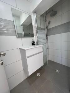 a bathroom with a sink and a mirror at Sea of Galilee place in Tiberias