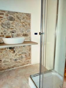 a bathroom with a sink and a shower at Don Ciccio GH in Bova Marina