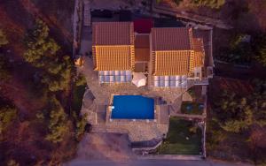 an overhead view of a building with a pool at Sun And Stone in Athani