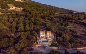 an aerial view of a house on a river at Sun And Stone in Athani