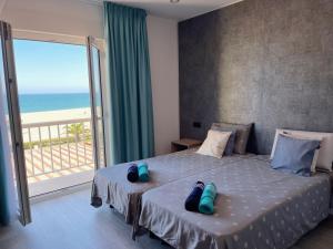 a bedroom with a bed with a view of the ocean at Villa Dru in Roquetas de Mar +83 photos