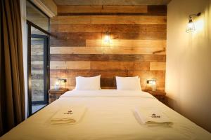 Postel nebo postele na pokoji v ubytování Ethno Sazano Hotel