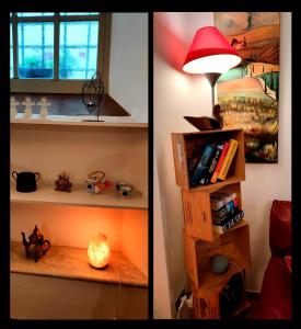 a room with a lamp and a shelf with books at Casa Vacanza in Casentino in Bibbiena