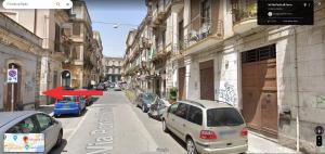 a view of a street with cars parked on the street at IL VICOLO DI PAOLA in Catania