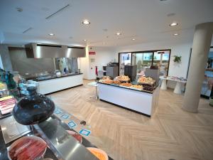 a store with a bakery with a lot of food at Hotel Taimar in Costa Calma
