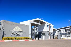 a building with a sign on the front of it at Sarona City Alpha Apartment L303 in Gaborone