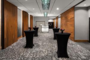 a lobby with black stools in the middle of a room at Courtyard by Marriott Seattle Bellevue/Downtown in Bellevue