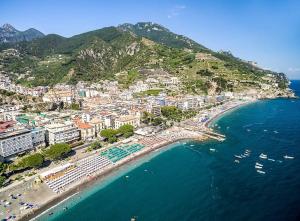 an aerial view of a beach with buildings and the ocean at Linea1 Amalfi Coast 500 Mt Beach in Maiori