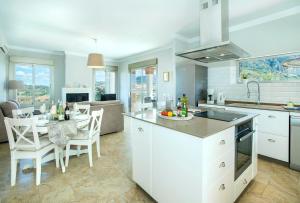 a kitchen and living room with a table and chairs at El Tajaral by Vintage Travel in El Gastor