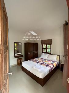 Postel nebo postele na pokoji v ubytování Khiang Khaolak ATV & Resort