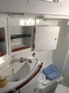 a bathroom with a sink and a toilet at bnsail barca a vela per crociere e veleggiate in Porto