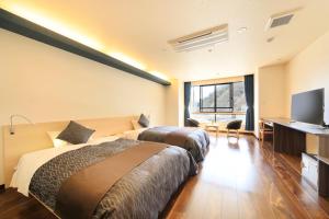 Voodi või voodid majutusasutuse 湯元ホテル阿智川 toas