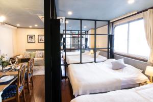 Postel nebo postele na pokoji v ubytování 【5/24NEW OPEN】浅草徒歩3分/Max9名/無料駐車場/渋谷直通