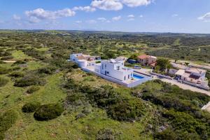 an aerial view of a white house with a yard at Villa Sonata in Ingrina Sol in Raposeira