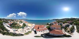an aerial view of a resort next to the water at C'est La Vie Rooms and Suites in Laganas