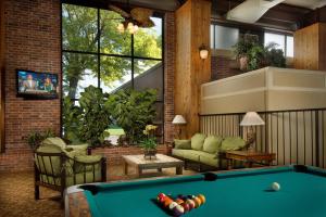 a living room with a pool table in it at Northwest Inn in Woodward