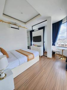 Postel nebo postele na pokoji v ubytování Hân Cao Hotel + 15 fotografií