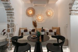 a dining room with a table and chairs at Annio studios in Plaka