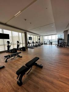 a gym with several exercise bikes in a room at Cosy 1 bedroom Burj Khalifa view in Dubai