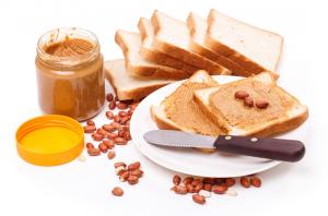 a plate of toast with coffee beans and a jar of peanut butter at Wildlife Resort Jim Corbett in Kālāgarh