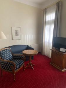 TV a/nebo společenská místnost v ubytování Hotel Sächsischer Hof