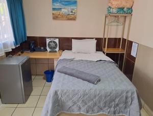 Sleep 'n Go Guesthouse客房内的一张或多张床位