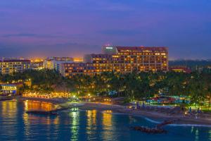 a view of a hotel and a beach at night at The Westin Resort & Spa, Puerto Vallarta in Puerto Vallarta