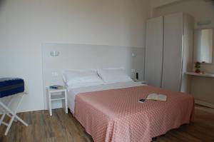 Letto o letti in una camera di Hotel Nelson
