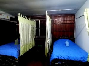 Postel nebo postele na pokoji v ubytování Lungmin homestay