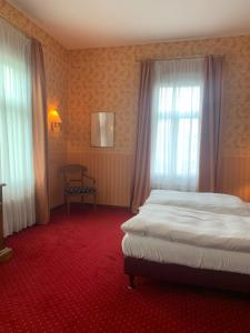 Postel nebo postele na pokoji v ubytování Hotel Sächsischer Hof