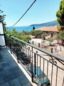 a balcony with a view of the ocean at Skardamoula's Studios n Apartments in Kardamyli
